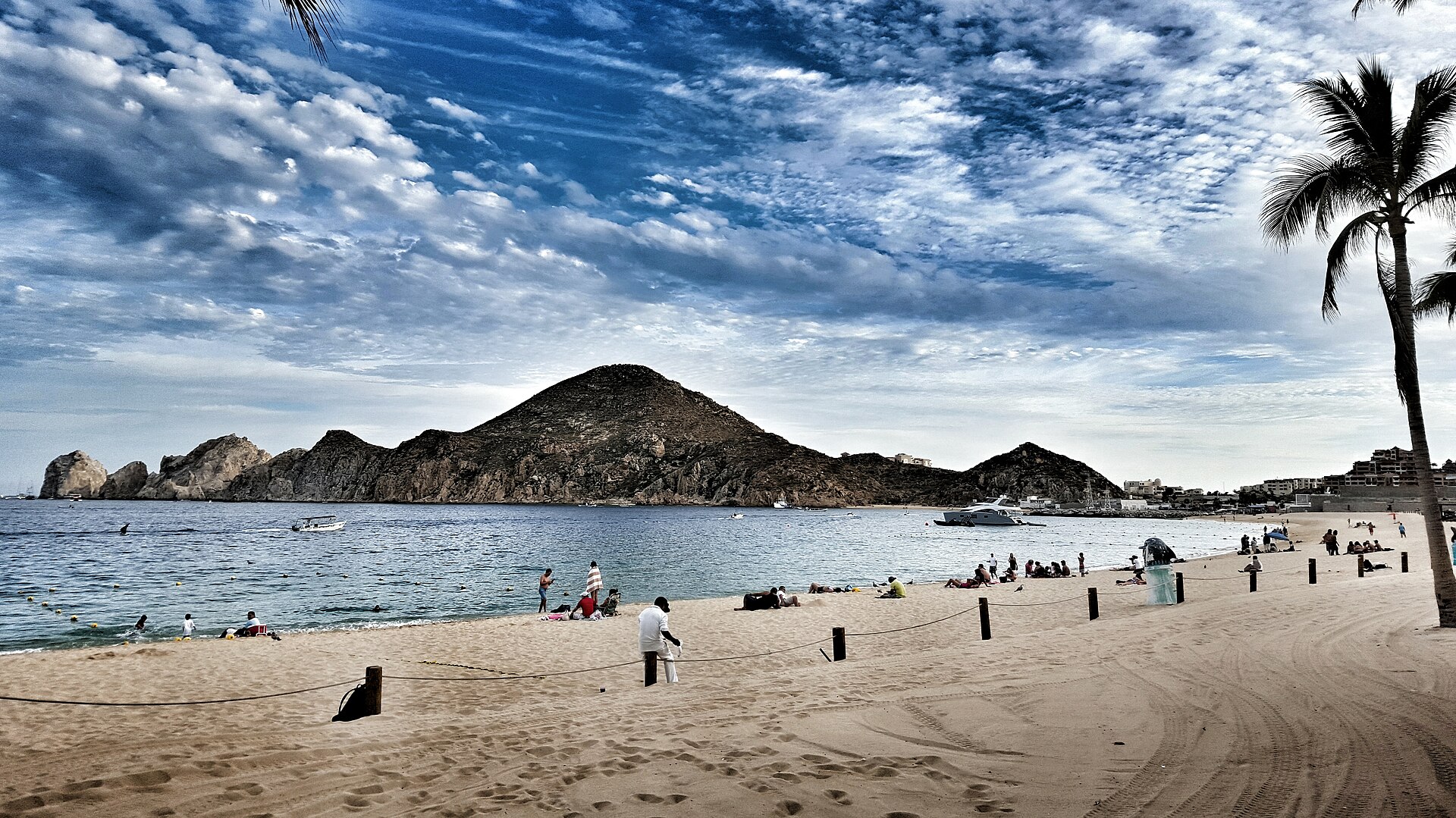 Médano Beach in Cabo San Lucas with the rocky headland of Land's End behind